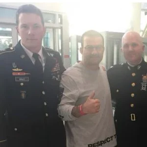 Carlos Machado with uniformed military officers