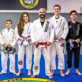 Instructors with students in gi